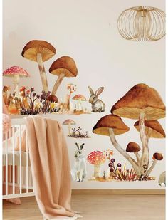 a baby's room with mushrooms and rabbits on the wall