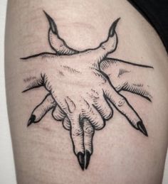 a close up of a person's arm and hand tattoo on the left thigh