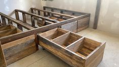 several wooden drawers sitting on the floor in a room