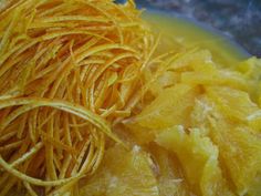 a close up of some food on a plate with orange peels and other things