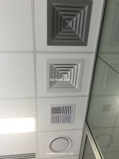 the ceiling has four different vents in it