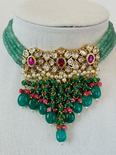 Gold Finish Bright Turquoise Green and Dark Red Beads Kundan Choker Set with Pearls, Mona Lisa Beads, and Stones Luxury Kundan Saree With Meenakari, Traditional Large Green Beads And Cabochons, Festive Beaded Choker With Round Beads, Green Beaded Bohemian Kundan Necklace, Green Bollywood Beaded Necklaces For Festive Occasions, Festive Multicolor Beaded Necklaces With Dangling Beads, Bohemian Green Beaded Kundan Necklace, Green Bohemian Beaded Kundan Necklace, Festive Multicolor Beaded Necklace With Dangling Beads