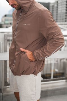 The Prime Windbreaker is the perfect layering piece to throw on top of your favorite outfit. This jacket offers functionality and comfort while also providing a sporty look to add to your wardrobe. Casual Brown Nylon Outerwear, Urban Moisture-wicking Activewear For Fall, Sporty Brown Outerwear For Outdoor, Brown Functional Outerwear For Fall, Brown Activewear For Workout In Fall, Brown Activewear For Fall Workout, Urban Moisture-wicking Windbreaker For Gym, Sporty Brown Outerwear For Spring, Athleisure Moisture-wicking Outerwear For Streetwear