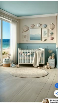 a baby's room with sea shells and seashells on the wall, along with a crib