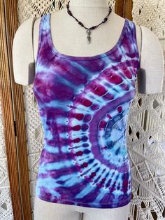 Beautiful hand tied & ice dyed tank top  Side ripple pattern in cool Purple, blue & pink  Ribbed cotton, Side medium Blue Casual Tank Top For Festival, Casual Blue Tank Top For Festivals, Tie Dye Tank Top For Summer, Fitted Blue Tank Top For Festival, Bohemian Tie Dye Tank Top For Festivals, Bohemian Tie Dye Sleeveless Tank Top, Fitted Tie Dye Tank Top For Summer, Purple Scoop Neck Tank Top For Summer, Hand Dyed Tie Dye Sleeveless Tank Top