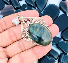 Rare Natural Blue Flashy Labradorite Sterling Silver Pendant ! 92.5 Sterling Silver Pendant ! Labradorite Boho Silver Pendant -2.40" Inch Gemstone Name - Natural Labradorite Pendant  Pendant  Length Size - 2.40" Inch  Pendant  width Size - 1.30" Inch Shape - Oval Shape Gemstone Size - 21x30mm Quantity - 1 Pendant  Code- E-23 100% Authentic Listing You can use to make Chains , Necklace , Bracelets and many more styles . Bulk wholesale pricing is available convo me for information on this listing or any others in my shop. We are continuously adding new products in our store. So keep coming back to see more great deals. We Provide Best Customer Service and all replies will made within 24 hrs . Please read our Policy For Shipping and Returns . We Also Accept Wholesale Or Orders And All Kinds J Labradorite Pendant, Sterling Silver Pendant, Oval Shape, Sterling Silver Pendants, Chains Necklace, Halloween Shopping, Silver Pendant, Labradorite, Accessory Gift