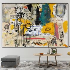 an abstract painting hangs on the wall above a coffee table