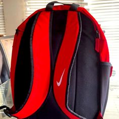 Nike Red Carry Backpack Brand New University Red Everyday Backpack, Red Nike School Bag, Nike Backpack For Students, Nike Standard Backpack For Students, Red Rectangular Sports Bag, Functional Red Backpack, Red Softback Backpack For Everyday Use, Nike Red Travel Bag, Red Nike Travel Bag