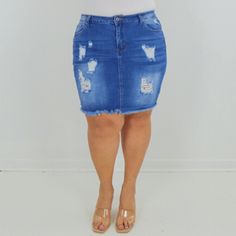 This distressed denim mini skirt is a must-have summer staple. The medium wash pairs perfectly with a graphic tee and sandals, while the mid rise and high stretch keep it comfortable all day long. Mid-rise Medium wash Lands on the knee Distressed details and destroyed hem High Stretch 98% cotton, 2% spandex Made in China CARE: Hand wash with cold water with like colors. Do not bleach. Flat dry. Iron if needed. FIT: Our model is wearing size 2X (14-16) Height: 5.3' Bust: 43" Waist: 36" Hips: 50" Summer Mid-rise Distressed Denim Skirt, Trendy Ripped Denim Skirt For Summer, Distressed High Rise Denim Skirt For Summer, Summer Distressed Denim Blue Skirt, Summer Distressed Medium Wash Denim Skirt, Blue Distressed Denim Skirt For Summer, Distressed Blue Denim Skirt For Summer, Casual Ripped Medium Wash Denim Skirt, Casual Ripped Dark Wash Denim Skirt