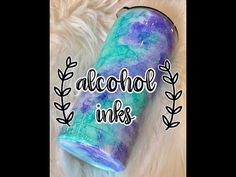 an acrobatic tube with the words alcohol inks written in white and blue