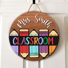 a wooden sign that says, mrs smith's classroom with pencils on it