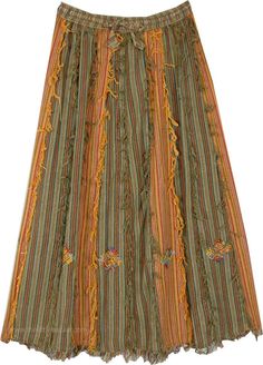 A one of a kind boho chic skirt in cotton, this long skirt is perfect for a summer fiesta! With its olive undertones, this multicolor fringe skirt has a striped look with patchwork on the lower hem. The cotton thread frills along the stitch give it a bohemian highlight - the frills are only on the front and at the hem. #tlb #Patchwork #Embroidered #Misses #Fringe #longskirt #cottonskirt #summerskirt Summer Cotton Skirt With Tassels, Bohemian Skirt With Tassels, Bohemian Cotton Bottoms With Fringe, Bohemian Cotton Fringe Bottoms, Bohemian Long Skirt With Tassels, Bohemian Tiered Skirt With Tassels, Bohemian Maxi Skirt With Tassels, Skirt With Frills, Boho Chic Skirts