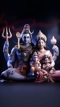 a statue of the hindu god and his wife with two babys in their lap