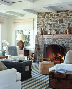 a living room filled with furniture and a fire place