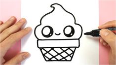 someone is drawing an ice cream cone on paper