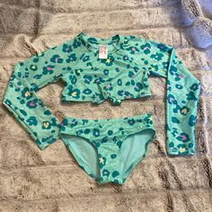 Swim Suit 2 Piece. New. Bought For Vacation And Never Worn. Leopard Print Long Sleeve Long Sleeve Swimming Sets For Spring, Fitted Green Swimming Sets, Playful Fitted Long Sleeve Sets, Green Fitted Sets For Playtime, Fitted Long Sleeve Sets For Playwear, Fitted Long Sleeve Playwear Sets, Fitted Long Sleeve Swimwear For Playtime, Fitted Long Sleeve Swimwear, Playful Pink Long Sleeve Swimwear