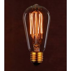 an old fashioned light bulb on a dark background