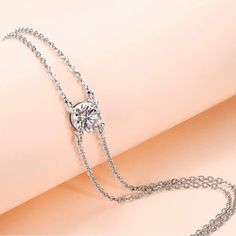 1 Carat Diamond Moissanite Solitaire Dainty Double Chain Adjustable Bracelet Retail Price - $299 Carat Weight - 1 Carat 6.5mm Stone Cut ~ Round Brilliant Color ~ D-E Clarity ~ Vvs1 Adjustable Bracelet ~ 6.5"+2" (16.5cm+5cm) Genuine Moissanite Solid 925 Sterling Silver 18k White Gold (Triple Plating For Extra Durability, Prevents Tarnishing & Adds Shine) Gra Gem Report & Certification Of Authenticity Included! Comes In Gift Box With Jewelry Polishing Cloth Suitable Size For Women And Girls. Comfo Moissanite Diamond Bracelet In White Gold For Gifts, White Gold Moissanite Diamond Bracelet For Gift, White Gold Moissanite Diamond Bracelet As Gift, Silver Sterling Bracelet With Single Diamond, Dazzling Silver Diamond Chain Bracelet, Dainty Silver Diamond Chain Bracelet, Silver Bracelet With Single Diamond In Fine Jewelry Style, Silver Bracelet With Single Diamond, Silver Diamond Bracelet With Single Diamond