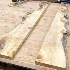 a table that has been made out of wood and is being worked on by a machine