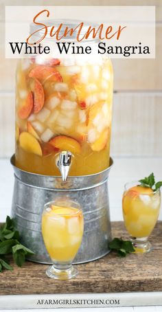 a glass jar filled with fruit and water