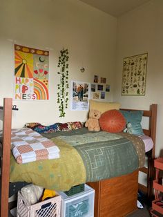 a bedroom with a bed and various pictures on the wall above it, including a teddy bear