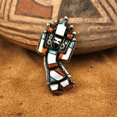 Authentic Vintage Rain Dancer Kachina 1960-70's Zuni inlay ring with Turquoise, Coral, Mother of Pearl.  Ring Size 4.5.  Set in Sterling Silver, unsigned. A very large statement piece to wear on your pinkie finger!  The top of the ring is about 1-1/4" across by 2-1/4" tall.   About Us We have been in the business of selling new and vintage Native American made jewelry for many decades.  Most of our jewelry comes from New Mexico and Arizona.  We deal only in quality made merchandise, not that lig Vintage Multicolor Multi-stone Turquoise Ring, Vintage Multicolor Inlay Jewelry, Vintage Multicolor Inlaid Jewelry, White Jewelry With Inlay, Unique White Jewelry With Inlay, Vintage White Multi-stone Jewelry, Bohemian White Collectible Rings, Authentic Turquoise Jewelry, Vintage Native American Jewelry