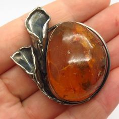 Unfortunately, stone is slightly chipped, but can be easily replaced by your local jeweler.800 Silver Vintage Real Large Amber Calla Lily Floral Pin BroochWeight: 19.8gWELCOME TO PAWN SHOPWe are an actual pawn shop and have been in business for over 25 years.Since 1990, our establishment has been serving a variety of clients by providing them with short term cash solutions and options of liquidity regarding their treasured heirlooms.Acknowledging that today′s customers are very sophisticated and Amber Brooch Jewelry Gift, Floral Pins, Swirl Ring, Sun Designs, Amber Earrings, Pawn Shop, Calla Lily, Earrings Photo, Amethyst Gemstone