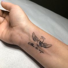 a person's arm with a tattoo on it that says love is in the air