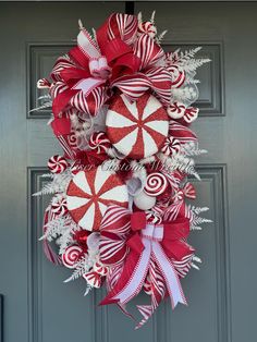 a red and white wreath with candy canes