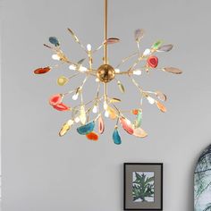 a chandelier hanging from the ceiling in a living room