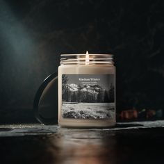 a candle sitting on top of a wooden table