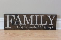 a wooden sign that says family life's greatest blessing