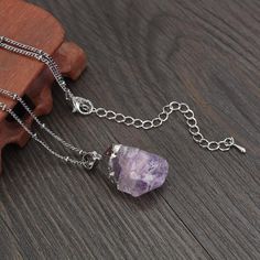 Feature:Material: amethystPendant shape: irregularChain length: 20" + 2.5" extended chainStyle: bohoQuantity: 1 pcPacking: Comes with GIFT box packaging--- Tips -----There will be some color, size and shape difference between the real items and the pictures because of the pendants is natural. --As this item is handmade, please allow for small variations in design.Please contact us at the first time if you have any problems about products.Dedicated to handicraft production, looking for better for Purple Metal Chain Necklace As Gift, Purple Metal Clavicle Chain Necklace, Purple Metal Chain Necklace Gift, Amethyst Pendant Necklace With Raw Stone, Amethyst Raw Stone Pendant Necklace, Adjustable Silver Necklace With Mineral Crystal, Silver Necklaces With Raw Stone In Mineral Crystal, Silver Necklace With Raw Stone And Mineral Crystal, Amethyst Crystal Necklace With Adjustable Chain As Gift