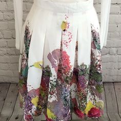 This Beautiful White Skirt With Floral Detail Is A Show Stopper. Fitted At The Waist With A Beautiful Light Flare. White Printed Skirt For Spring, Multicolor Floral Print Skirt For Garden Party, Spring Fitted Printed Skirt, Fitted Printed Skirt For Spring, Spring A-line Skirt For Garden Party, Spring Multicolor A-line Skirt, Spring Multicolor Pleated Skirt, Elegant Multicolor Skirt For Spring, Elegant Multicolor Spring Skirt