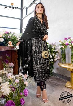 FABRIC: LAWNCOLOR: BLACK PRODUCT DETAILS Iqra slays in this classy noir ensemble brought to life by heavily done chickankari embroidery done in herringbone stitch adorned with 5 mm muted copper sequins and banarsi zari working wonders in this design. It comes with an embroidered chiffon dupatta and solid dyed pants.DESIGN DETAILS:1.25 meters Embroidered Jaal For Front on lawn (W 32" H 45")1 piece Embroidered Chan on lawn for back32” Embroidered border for front daaman32” Embroidered border for b Black Sharara With Resham Embroidery, Black Georgette Anarkali Traditional Wear, Festive Black Unstitched Sharara, Black Palazzo Set With Zari Work For Party, Black Embroidered Georgette Lawn Suit, Embroidered Black Georgette Lawn Suit, Elegant Black Sharara For Festive Occasions, Black Palazzo Set With Intricate Embroidery For Wedding, Black Embroidered Palazzo Set For Wedding