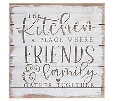 a wooden sign that says the kitchen, a place where friends and family gather together