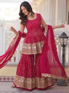 Elevate your ethnic wardrobe with our stunning "alluring rani pink sequins georgette wedding wear sharara suit." This three-piece ensemble includes a georgette suit, sharara, and dupatta, all adorned with intricate sequin work and thread embroidery in a beautiful rani pink color. The fully stitched sharara suit is available in sizes M to XXL, making it perfect for weddings, receptions, festivals, and special functions. Pair it with some accessories to complete your elegant look and stand out at any event. Crafted with high-quality georgette fabric, this sharara suit offers a comfortable and stylish fit for all-day wear. The sequin work and thread embroidery add a touch of glamour and sophistication, making it a must-have for any special occasion. Pink Sharara, Sequin Suit, Gharara Suits, Sharara Designs, Party Wear Kurtis, Embroidered Sarees, Sharara Suit, Indian Wedding Wear