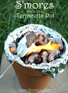 a pot filled with marshmallows and some kind of bbq on top of it