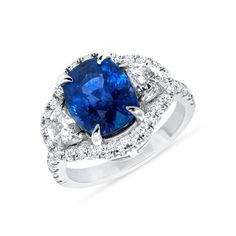 This stunning natural sapphire and diamond ring is sure to amaze. This ring consists of a 2.00 ct. Oval Cut Blue Sapphire center stone, surrounded by 1.25 ct. Half-moon and Brilliant Round Cut diamonds on a prong setting with a halo design.  Halo Design Oval Cut Sapphire Ring with Diamonds 1.25 ct. Item Features * New in box with tags * Metal Stamp: 14k, 18k, or Platinum * Gold: Yellow, White, and Rose * Natural Oval Cut Sapphire * Total CTW Center Stone: 2.00 carats * Natural Half-moon and Bril Gia Certified Oval Sapphire Diamond Ring, Oval Sapphire Gemstone With Halo Setting, Dazzling Oval Sapphire Gemstones, Oval Sapphire Ring Gia Certified, Dazzling Oval Sapphire Diamond Ring, Gia Certified Oval Lab-created Sapphire Diamond Ring, Exquisite Oval Sapphire Ring With Diamond, Oval Sapphire Gemstones In Halo Setting, Fine Jewelry Oval Lab-created Sapphire Ring