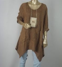 Not sure about that tag thing, but I love the linen top. Casual Brown Spring Tunic, Casual Brown Tunic For Spring, Casual Beige Tunic For Fall, Linen Lagenlook Tunic Top, Linen Lagenlook Blouse For Fall, Linen Tunic Top In Lagenlook Style, Lagenlook Linen Tunic Top, Lagenlook Tunic For Layering With Relaxed Fit, Fall Lagenlook Tunic Blouse