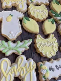 baby shower cookies are arranged on a table