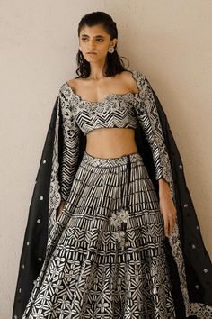 Black lehenga with all-over metallic tape and sequin embroidery. Comes with full length sleeves matching blouse and border embroidered dupatta.
Component: 3
Pattern: Embroidery
Type Of Work: Metallic tape and sequin embroidery
Neckline: Scoop
Sleeve Type: Long
Fabric: Silk Organza
Color: Black
Other Details: 
Dupatta with floral embroidered border
Lehenga with cutwork hem
Closure: Blouse: Side zip
Occasion: Sangeet - Aza Fashions Designer Wear Lehenga With Motifs, Festive Party Lehenga With Motifs, Party Lehenga With Motifs For Navratri, Navratri Party Lehenga With Motifs, Bollywood Party Sets With Motifs, Floor-length Party Choli With Motifs, Bollywood Wedding Palazzo Set With Motifs, Party Floor-length Choli With Motifs, Black Sets With Intricate Embroidery For Receptions