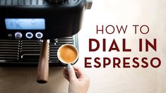 a person holding a cup of coffee in front of an espresso machine with the words how to dial in espresso