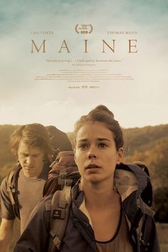 the movie poster for maine with two young men walking in front of trees and mountains