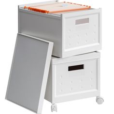 two white boxes with orange handles on each side and an open drawer in the middle