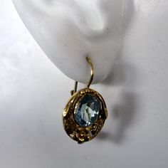 Victorians love Romantic settings such as this 14k gold floral openwork oval holding a dazzling blue topaz.  European backs for pierced ears. Luxury Oval Blue Topaz Earrings, Formal Oval Topaz Earrings, Oval Topaz Earrings For Formal Occasions, Gold Oval Blue Topaz Earrings, Elegant Oval Topaz Earrings, Lapis Earrings, Blue Topaz Earrings, Gold And Blue, Cubic Zirconia Earrings