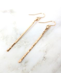 "Minimal, Modern earrings for your everyday style, our NEW Dany hammered bar earrings are an easy go to option for any occasion. Hand forged from 100% 14k Gold Fill or Sterling Silver that will last for years to come. Sleek and dainty yet sturdy, this sophisticated design is a great gift option for any age. See a similar style, the Trixi Spike earrings here >> https://www.etsy.com/listing/601462758 DETAILS » Measurements: 2 - 2.25\" drop from ear | 0.2\" wide » Materials: 14k Gold Filled o Minimalist Everyday Linear Earrings With Hammered Detail, Everyday Minimalist Hammered Linear Earrings, Classic Hammered Earrings For Everyday, Minimalist Hammered Long Drop Earrings, Minimalist Hammered Dangle Linear Earrings, Minimal Gold Earrings, Spikes Fashion, Round Cut Diamond Earrings, Lingot D'or