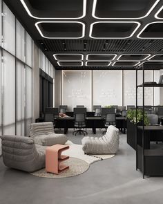 an office with modern furniture and lighting