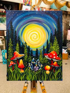 an easel holding up a painting with mushrooms and trees in the background at night