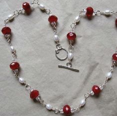 "Beautiful wedding Necklace. 18\" long. White Pearls are 4 x 6mm Red faceted glass beads are 6.5 x 10mm Clear Faceted Crystals are 3 x 5mm I hand assembled each section with 92.5 Sterling silver wire and hand forged the toggle clasp. Please look closely at pictures before you purchase. You will receive necklace in photos. Thank you for looking (: Custom orders are always welcome." Red Cherry, White Freshwater Pearl, Wedding Jewellery Necklace, Faceted Glass, Faceted Crystal, Toggle Clasp, Hand Forged, Wedding Necklace, Silver Wire